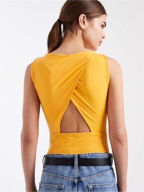 ASOS polyamide slikky open
back racer bodysuit in orange yellow Size M